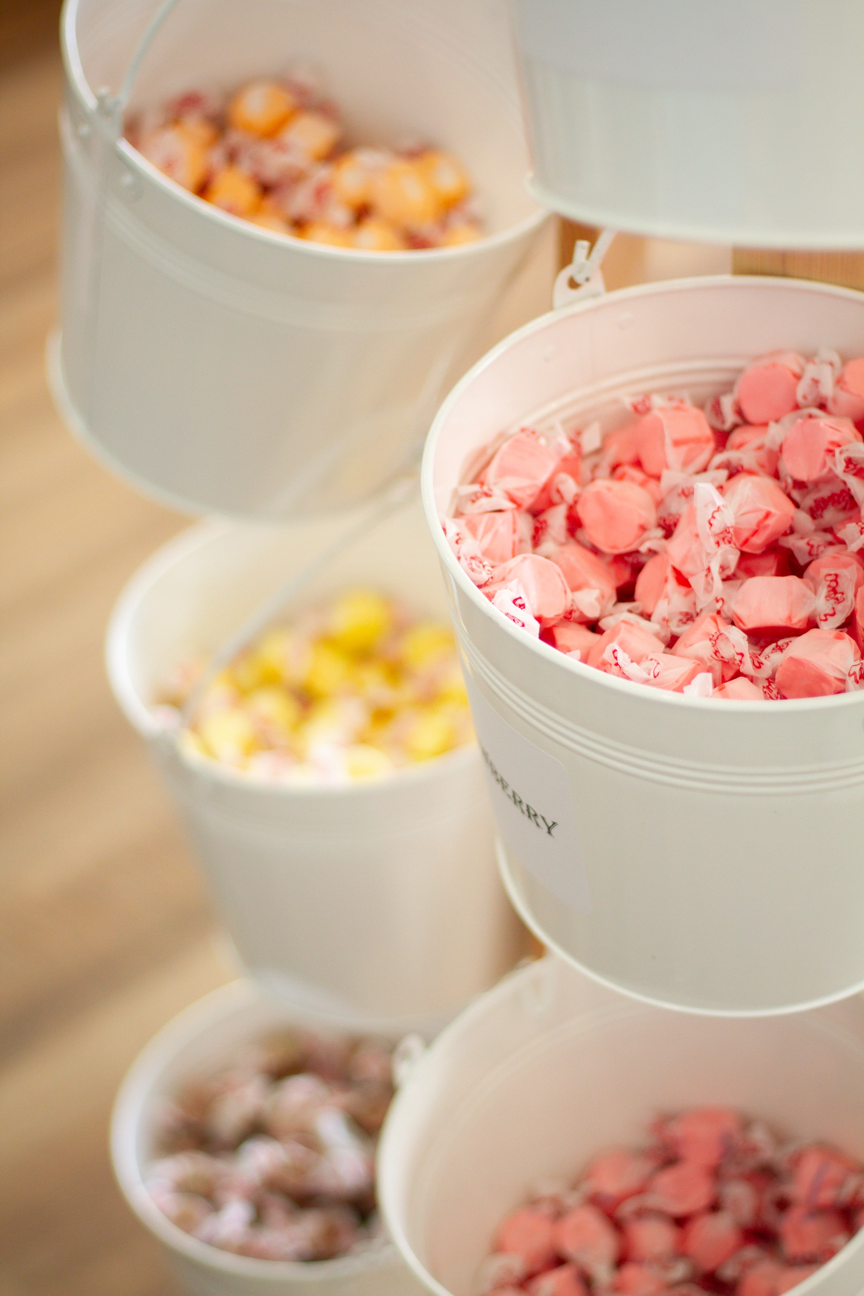 cascading buckets of pastel salt water taffy